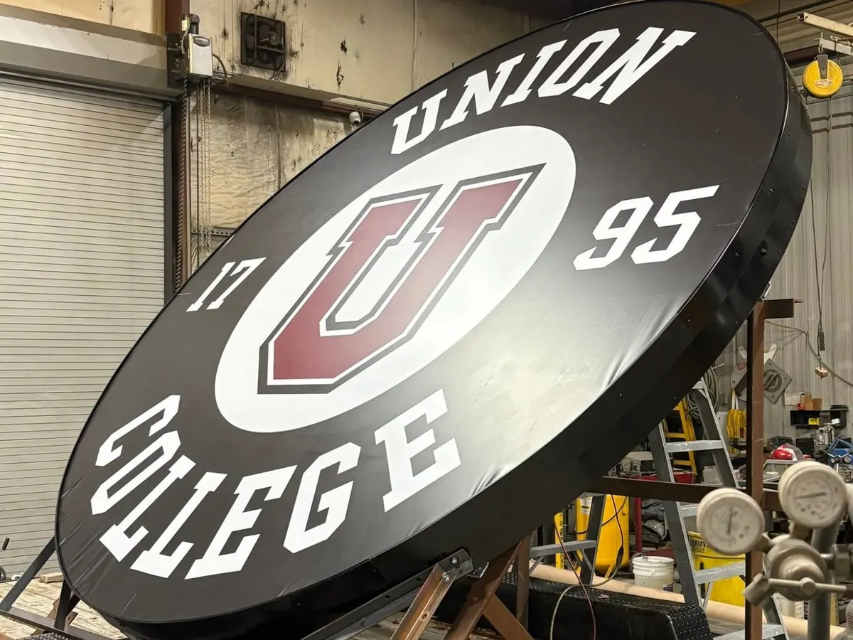Union College sign built in the Saxton Signs shop, loaded on a trailer